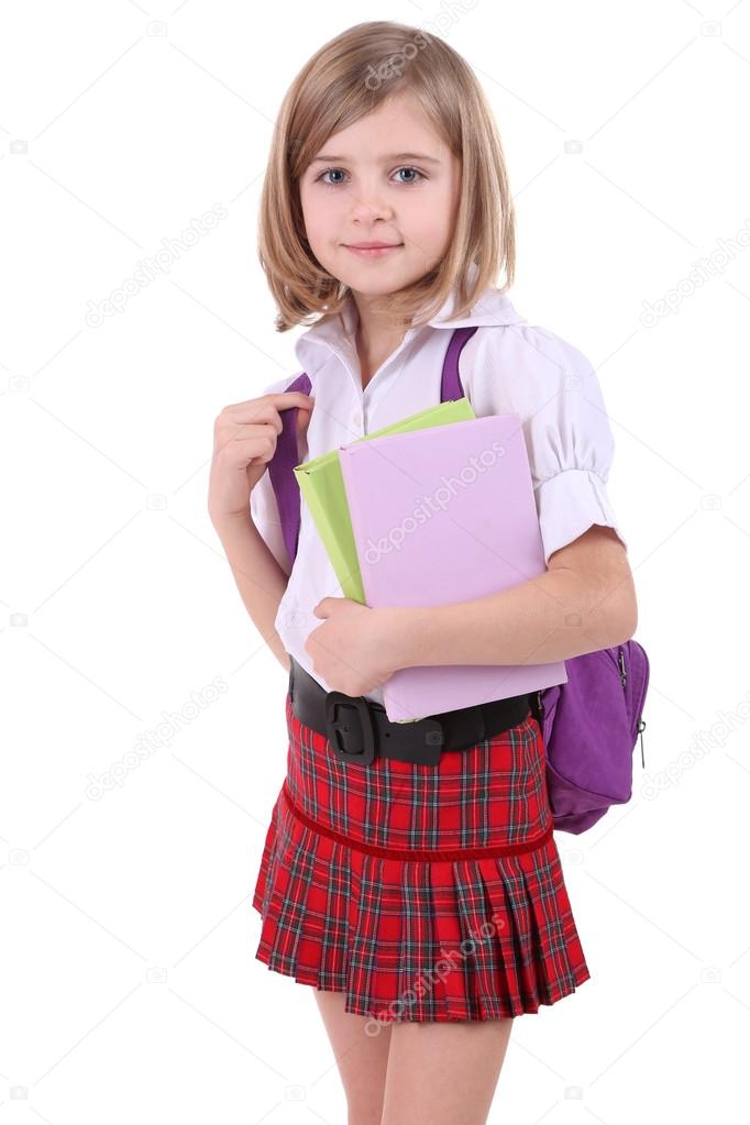 Beautiful little girl with backpack holding books isolated on white — Stock Photo © belchonock