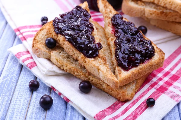 Delicious toast with jam on table close-up — Stock Photo, Image