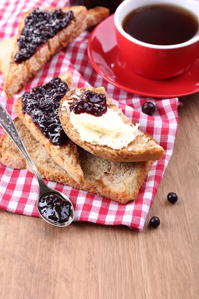 Delicious toast with jam on table close-up — Stock Photo, Image