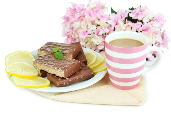 Cup of tea and sweets isolated on white — Stock Photo, Image