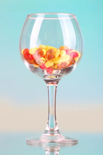 Goblet with pills on natural background — Stock Photo, Image