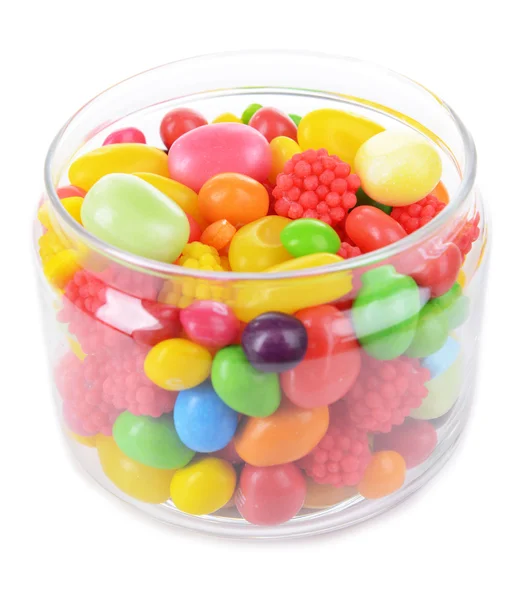 Farklı renkli meyve şekeri üzerine beyaz izole kavanoz içinde — Stok fotoğraf