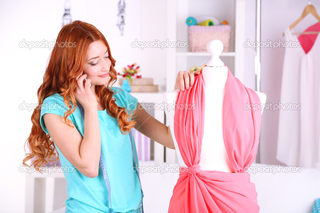 Young Girl Fashion Designer Creates New Dress In Workroom