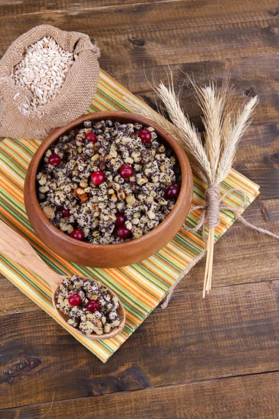 Plate with kutia -  traditional Christmas sweet meal in Ukraine, Belarus and Poland, on wooden background — Stock Photo, Image