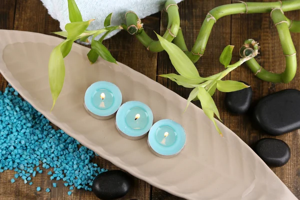 Beautiful spa setting with bamboo on wooden background — Stock Photo, Image