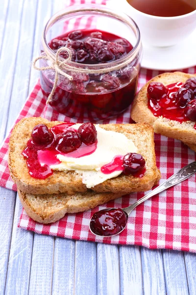 Delicious toast with jam on table close-up — Stock Photo, Image