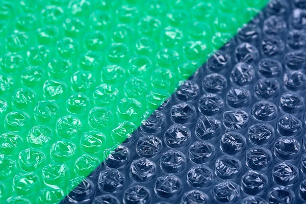 Färg plast bubbla förpackningsmaterial, närbild — Stockfoto