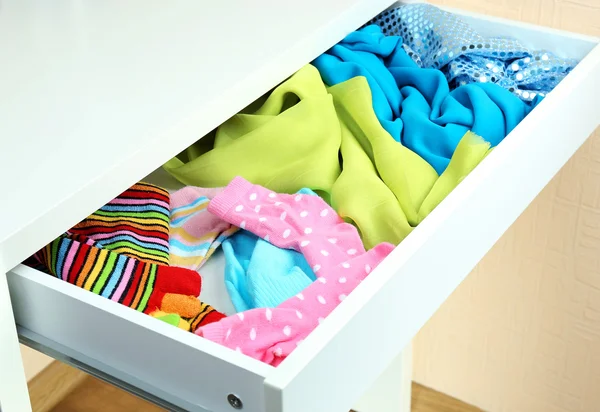 Open drawer with clothes close up — Stock Photo, Image