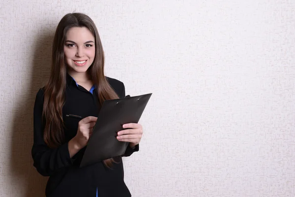 Portrait of business woman near wall — Stok Foto