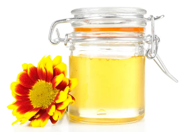 Sweet honey in glass jar isolated on white — Stock Photo, Image