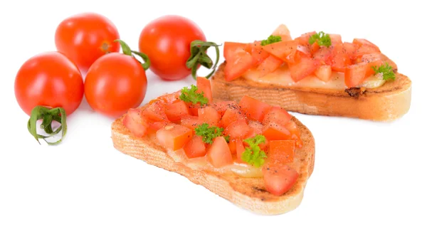Deliciosa bruschetta con tomates aislados en blanco —  Fotos de Stock