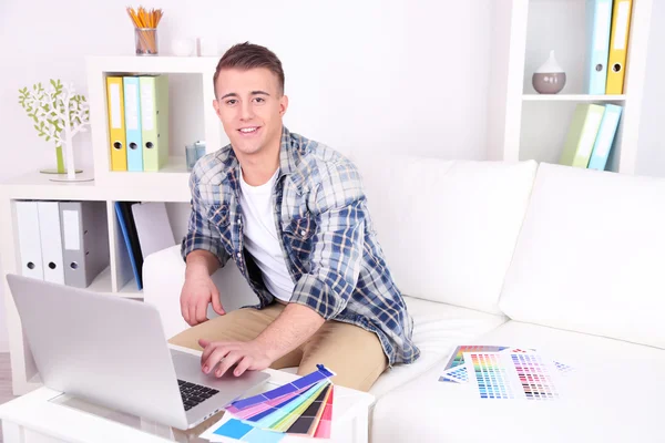 Young creative designer working at home — Stock Photo, Image