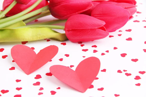 Paper hearts with flowers on bright background — Stock Photo, Image