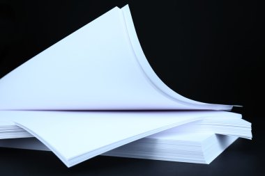 White paper on black background close-up clipart
