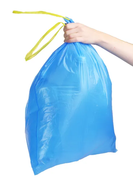 Bolsa de basura azul con la basura en la mano aislado en blanco —  Fotos de Stock