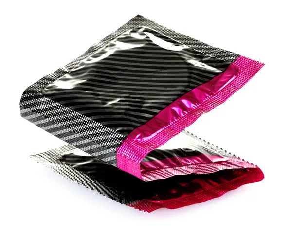 Three condoms in pack isolated on white — Stock Photo, Image