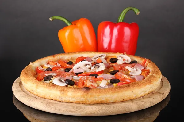 Aromatic pizza with vegetables isolated on black — Stock Photo, Image