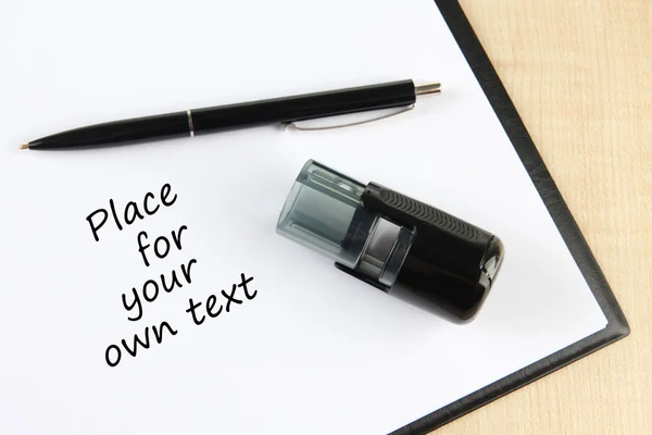 Stamp and clipboard on table — Stock Photo, Image