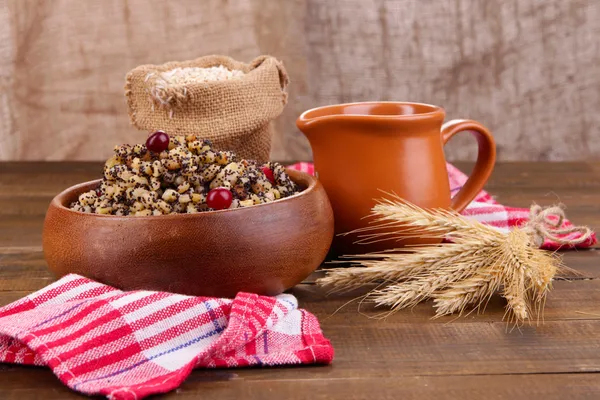 Plate with kutia -  traditional Christmas sweet meal in Ukraine, Belarus and Poland, on wooden background — Stock Photo, Image