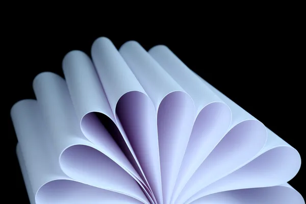 Abstract image of sheets white paper wave shape on black background close-up — Stock Photo, Image