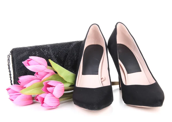 Beautiful black female shoes, bag and flowers, isolated on white — Stock Photo, Image