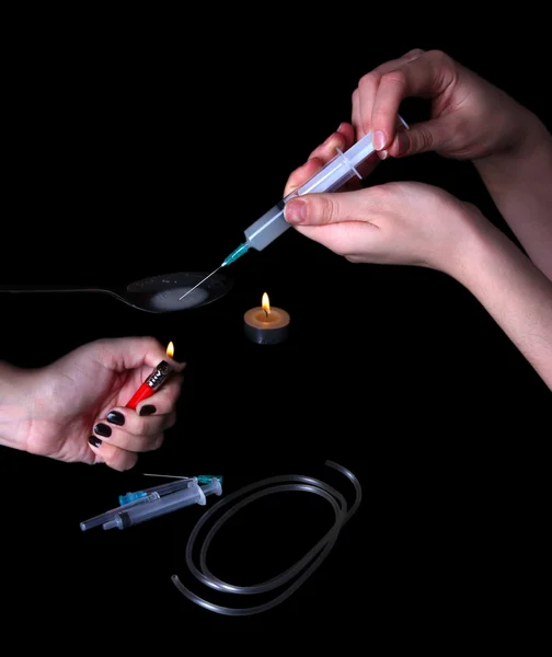 Drug addicts with syringe on black background — Stock Photo, Image