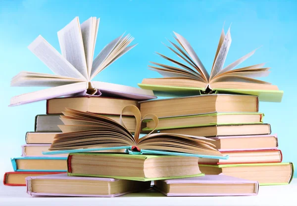 Stacks of books on table on natural background — Stock Photo, Image