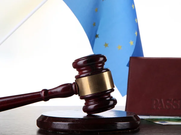 Gavel, money, passport and flag of Europe, on wooden table, on light background — Stock Photo, Image