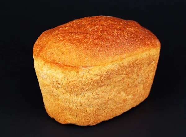 Loaf of bread on black background — Stock Photo, Image