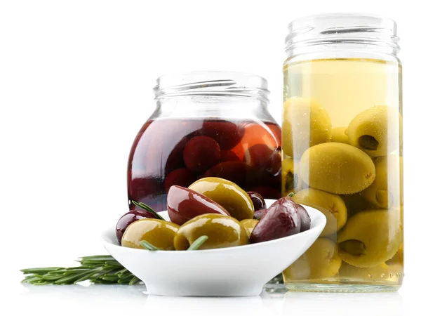 Tasty olives in glass jars, isolated on white — Stock Photo, Image