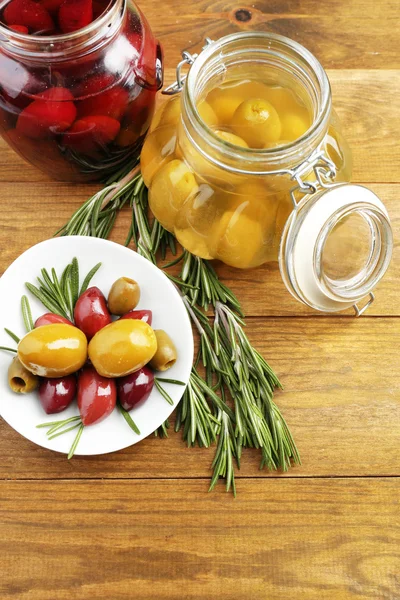 Tasty olives on wooden table — Stock Photo, Image