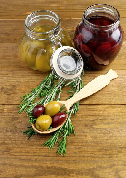 Tasty olives on wooden table — Stock Photo, Image