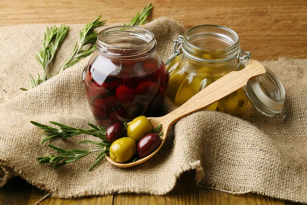 Tasty olives on wooden table — Stock Photo, Image