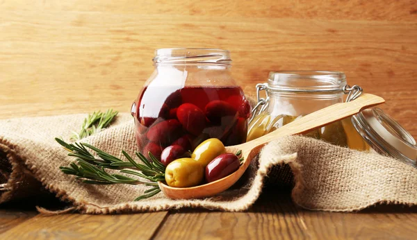 Tasty olives on wooden table — Stock Photo, Image