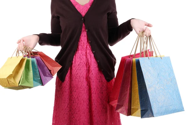 Young woman holding colorful shopping bags in  her hand, isolated on white — Stock Photo, Image