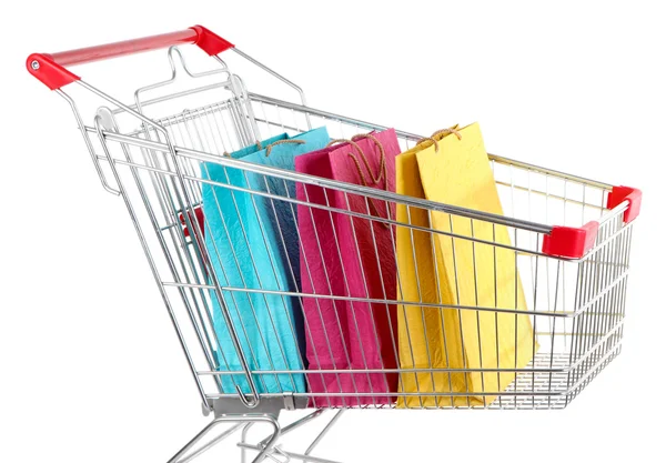 Bolsas de compras coloridas en el carro de la compra, aisladas en blanco — Foto de Stock