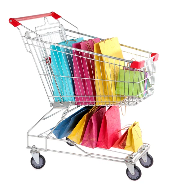 Colorful shopping bags in shopping trolley, isolated on white — Stock Photo, Image