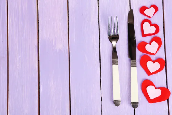 Valentines day dinner with table setting on wooden table close-up