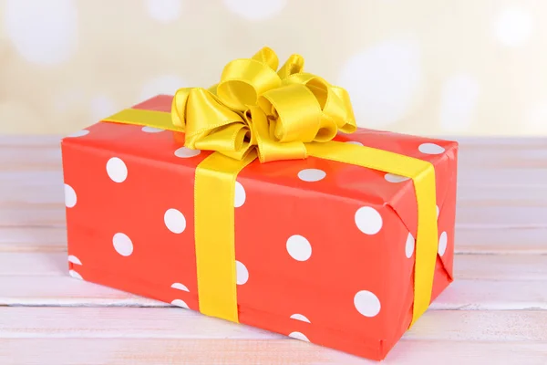 Gift box on table on light background — Stock Photo, Image