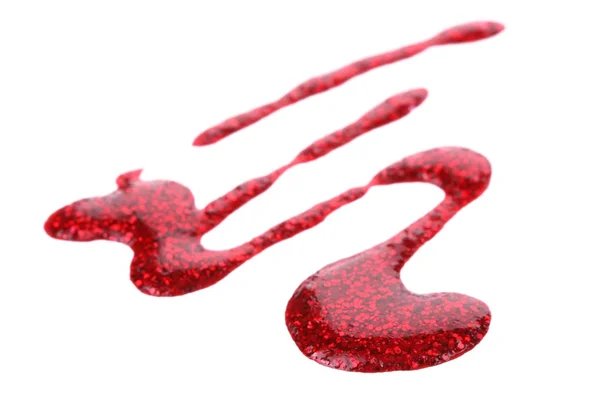 Roter Nagellack tropft isoliert auf weiß — Stockfoto