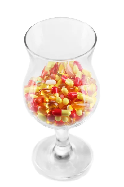 Goblet with pills isolated on white — Stock Photo, Image