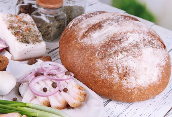 Rye bread with lard and onion on table close up — Stock Photo, Image