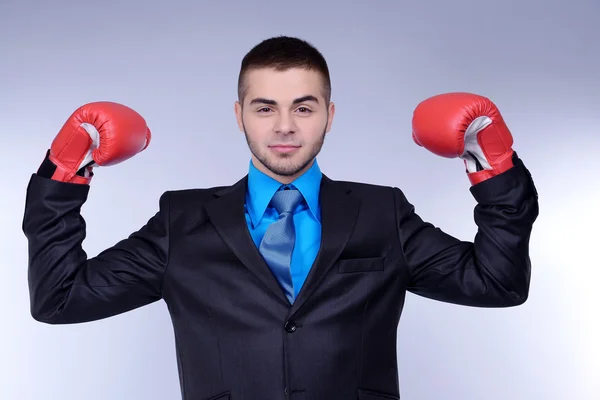 Business man on grey background — Stock Photo, Image