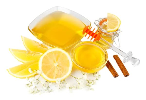 Zoete honing met citroen geïsoleerd op wit — Stockfoto