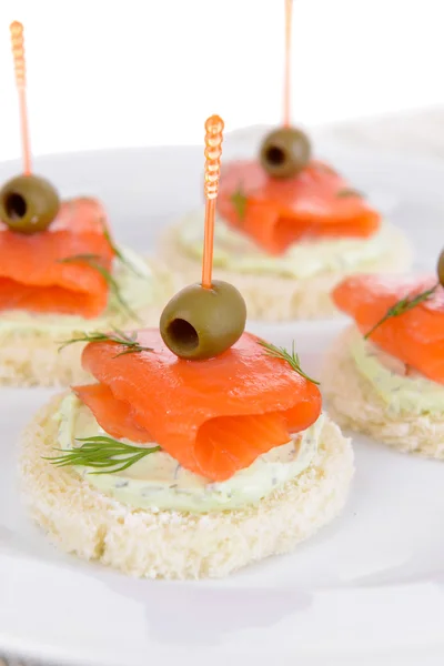 Delicious canapes on plate close-up — Stock Photo, Image
