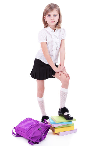 Beautiful little girl holding backpack isolated on white