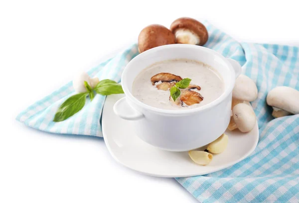 Mushroom soup in white pot, on napkin, isolated on white — Stock Photo, Image