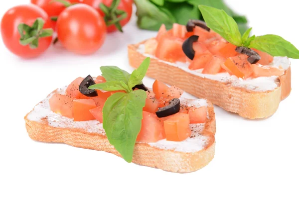 Delicious bruschetta with tomatoes isolated on white — Stock Photo, Image