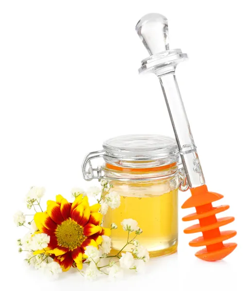Γλυκό μέλι σε γυάλινο βάζο που απομονώνονται σε λευκό — Φωτογραφία Αρχείου