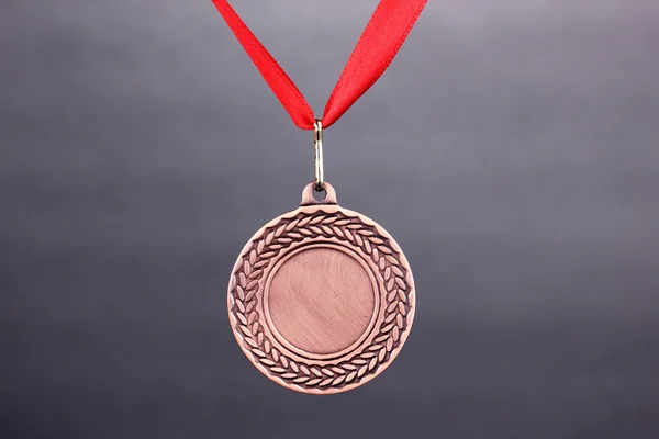 Três medalhas em fundo cinza — Fotografia de Stock